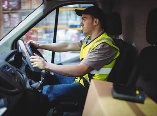 courier driving a van