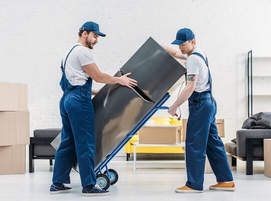 workers loading household goods for shipping