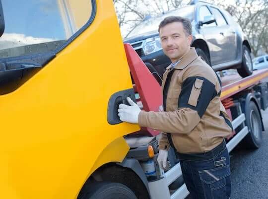 driver picking up car for transport to Canada